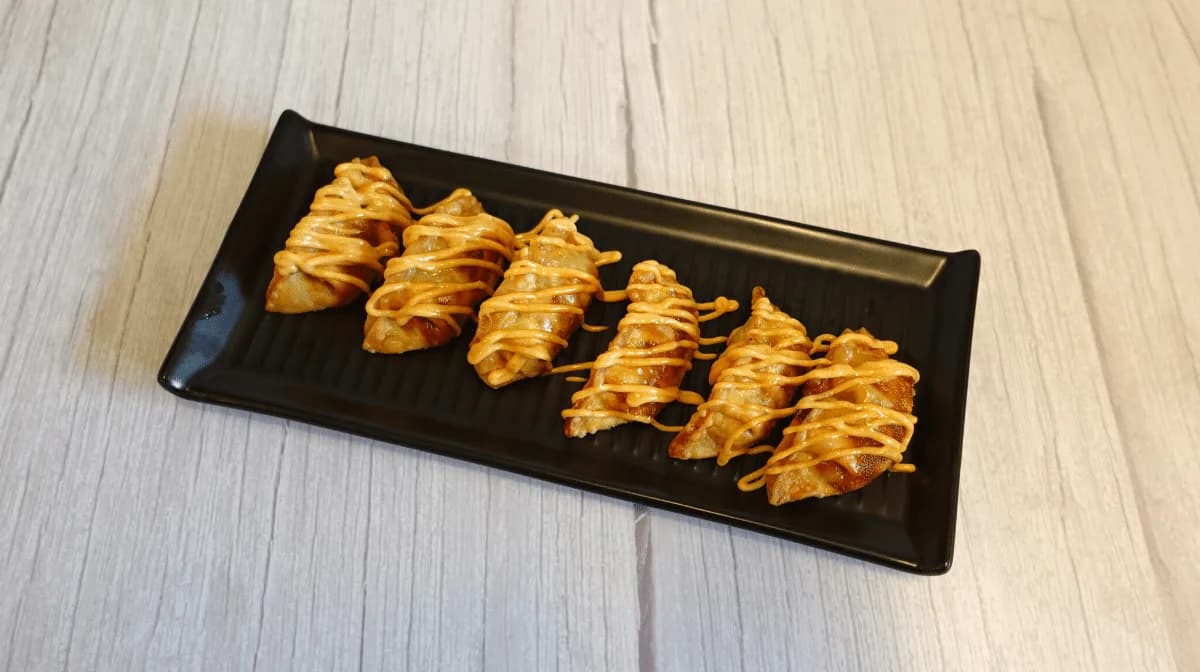 Chili Sesame Aioli Chicken Dumplings — six crispy dumplings